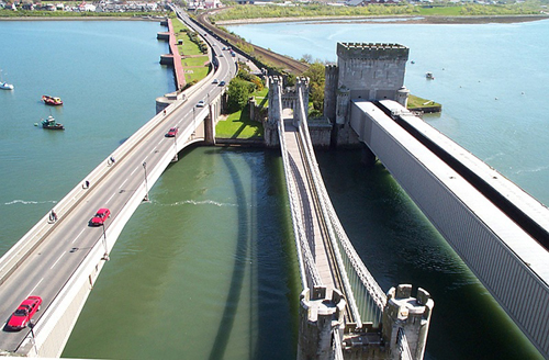Photograph showing the Conway Tubular Bridge, Telford's suspension bridge suspension bridge and the adjacent Conway castle 