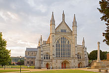Photograph of Winchester Cathedral west façade dawn with war memorial at right